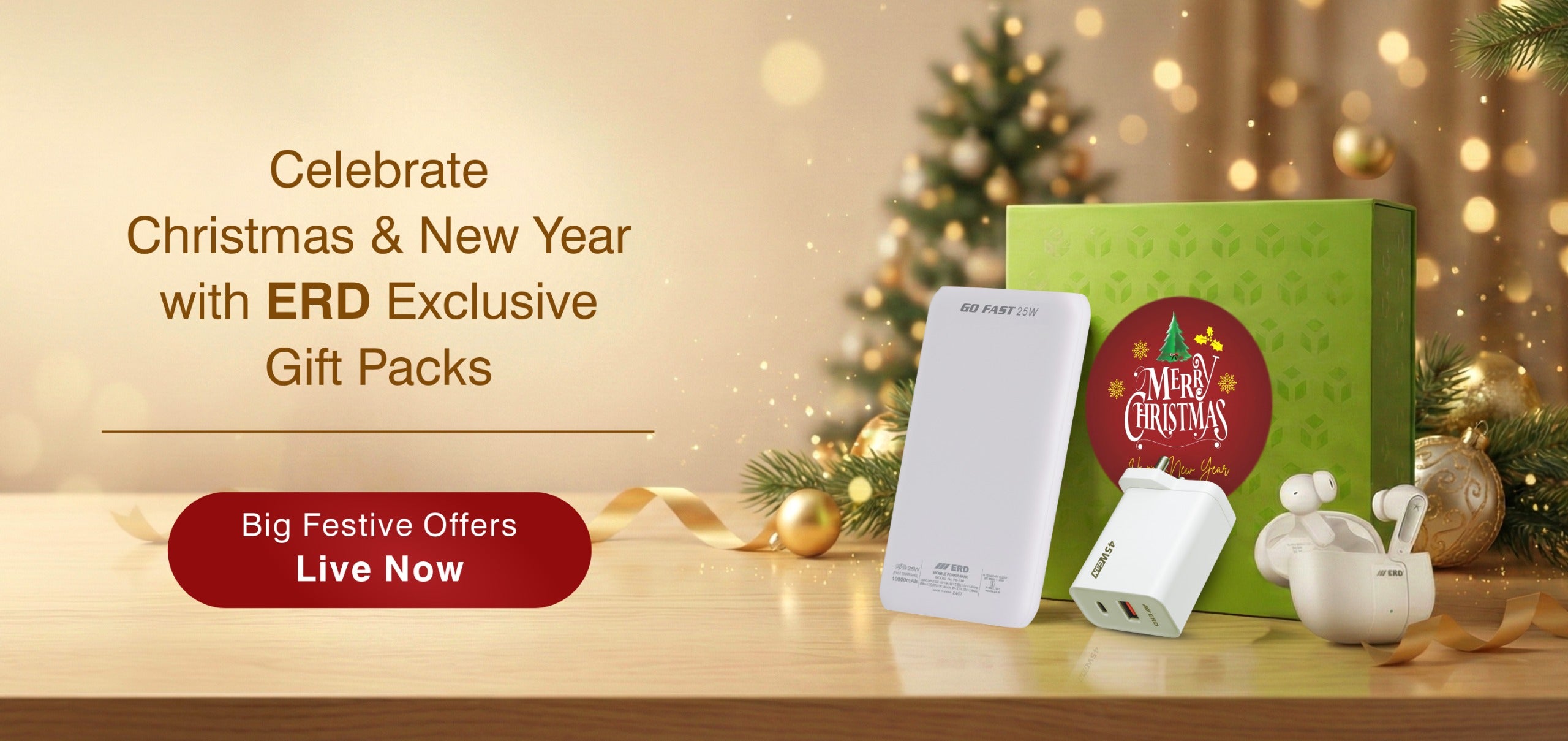 Gift pack with electronic devices on a wooden surface, Christmas tree in the background