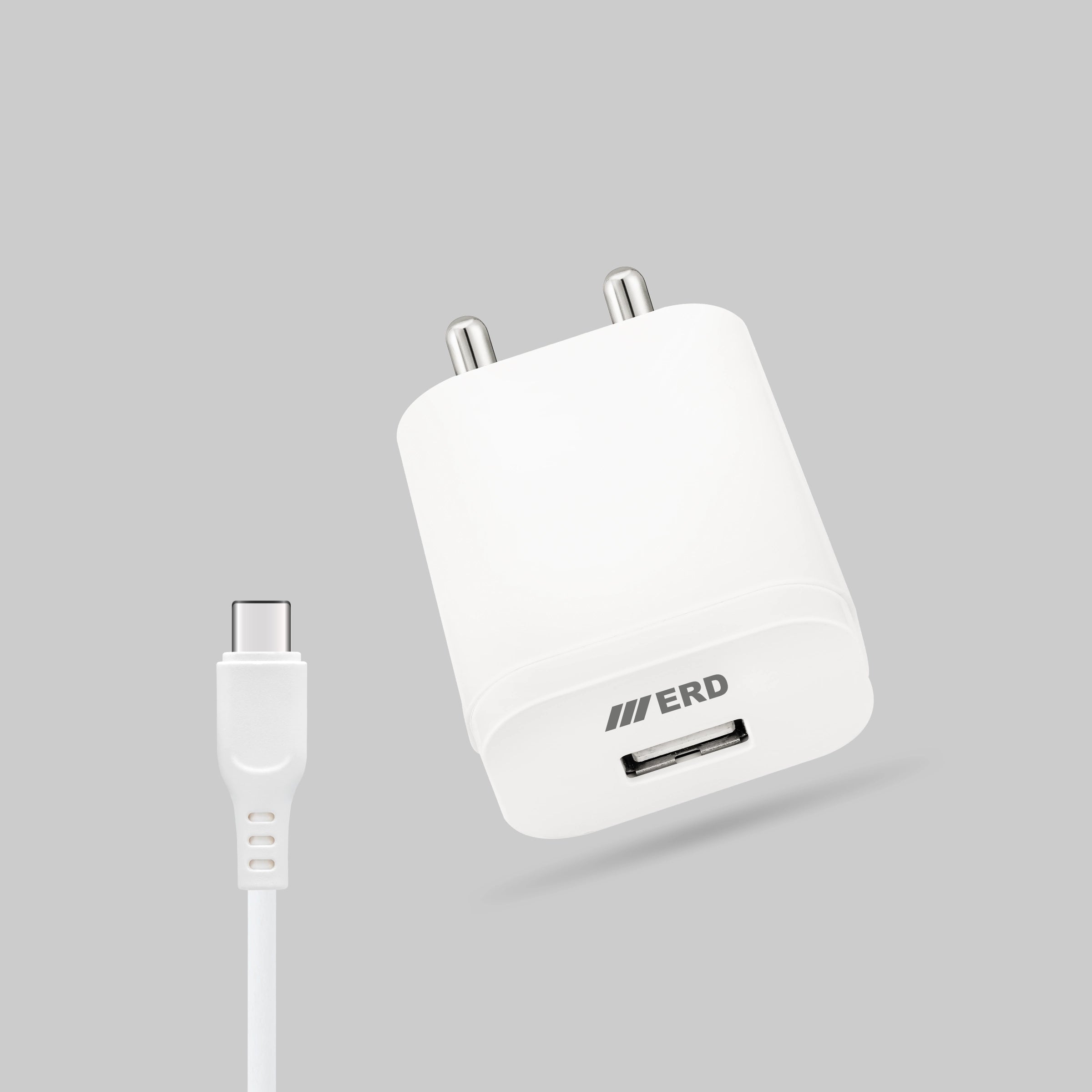 White USB charger with cable on a gray background